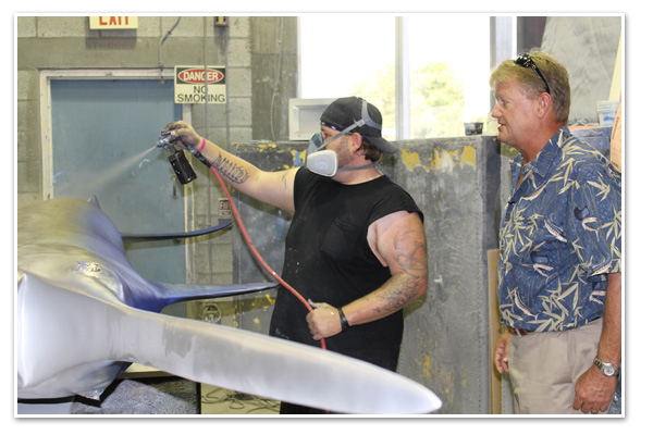 Guy Harvey overlooking paint job at Gray Taxidermy